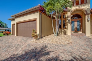 View of garage and entry way