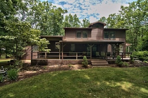 Covered porch overlooking the yard 
