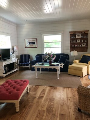 Living room with television and internet and brand new big windows 