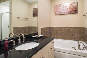 Master bath with tub and standing shower.