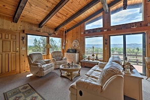 Floor-to-ceiling windows reveal soothing mountain views.