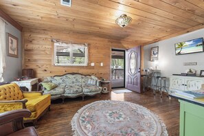 living room with storm door for looking out towards the river. 