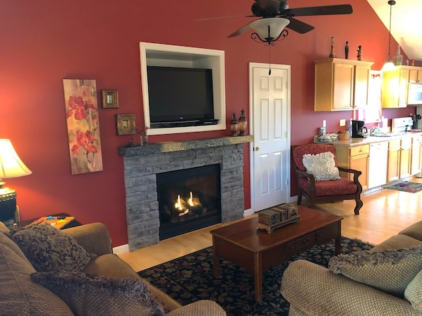 Seating for 6 in this cozy living room with fire place & 42-inch SMART LCD TV