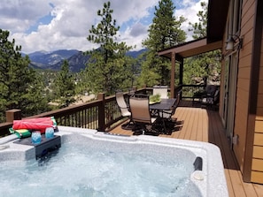 Hot tub, dining, and relaxing on the covered deck