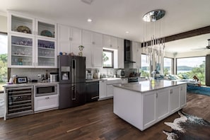 Gourmet kitchen with stainless steel appliances and a view that just doesn't end