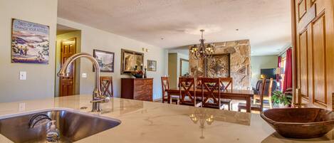 Kitchen, dining, living room  with floor to ceiling windows and oh the views!