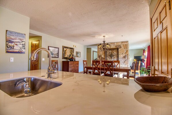 Kitchen, dining, living room  with floor to ceiling windows and oh the views!