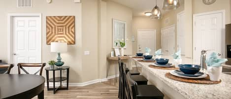 open kitchen with a huge granite counter top