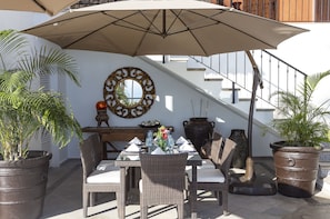 The shaded poolside terrace table makes for the perfect spot to enjoy lunch