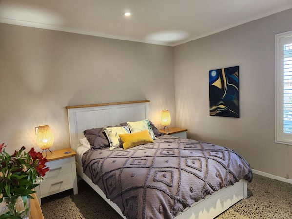 Comfortable ambient bedroom for restful sleep.