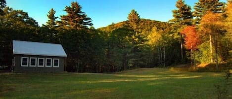 A view of the cottage from the large mowed yard 