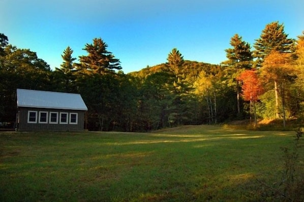 A view of the cottage from the large mowed yard