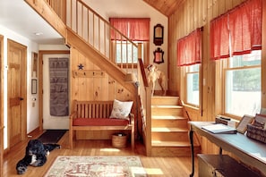Come on in and take your shoes off! There is plenty of storage under the stairs.