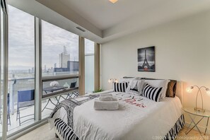 Master bedroom with a cozy queen bed and an amazing view.