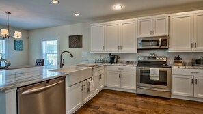 Beautiful, fully equipped kitchen.  Includes 4 bar stools for extra seating