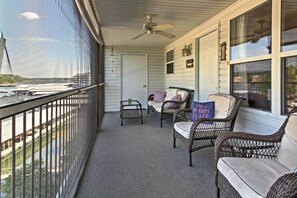 This vacation rental has a covered balcony overlooking the lake.