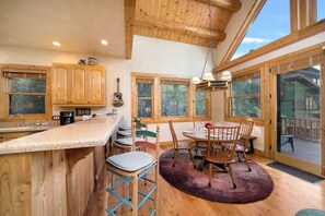 Breakfast Bar and Dining Room - Comfortably seat 6 guests at the table and an additional 4 bar stools at the breakfast bar.