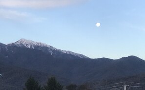 Full moon rising over snow cap Mt. Bogong 