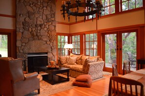 Living room with its giant fireplace to cozy up next to in the winter