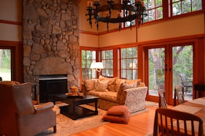 Living room with its giant fireplace to cozy up next to in the winter