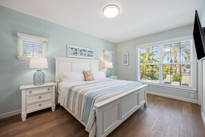 King size bed with nightstand and lamps
