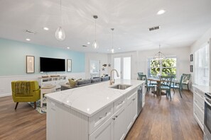 Stainless steel appliances include refrigerator, microwave, electric stove/oven, dishwasher