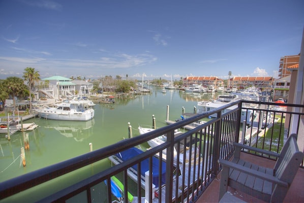 Enjoy a fantastic view of the marina and Boca Ciega Bay from the private balcony