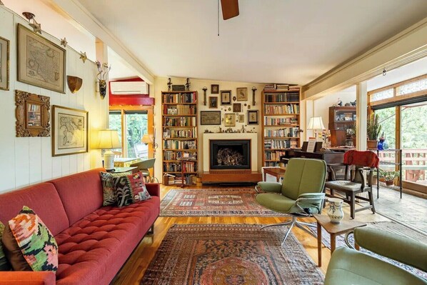 View of living room after entry; deck to the right, dining area to the left