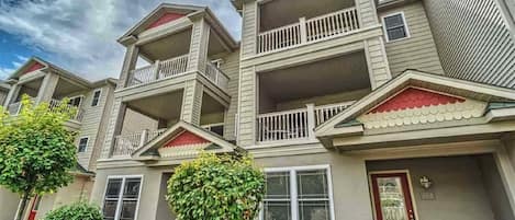 Our Townhome entrance faces the courtyard with two balconys overlooking the pool