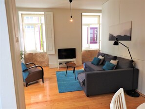 Living room with sofa bed and Smart TV