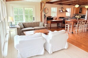 The kitchen is open to the adjacent sitting area