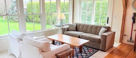 Sitting area and window room looks over the back yard and is adjacent to kitchen