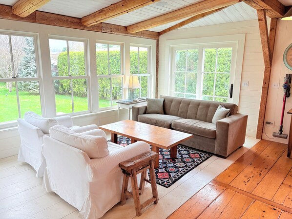 Sitting area and window room looks over the back yard and is adjacent to kitchen