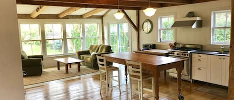 The kitchen is set up for socializing and features a Wolf range