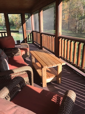Screened in Porch with mountain views and the peaceful melody of the creek.