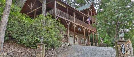 The driveway pulls right up to the cabin where you can enter from the downstairs door or through the lower bedroom door