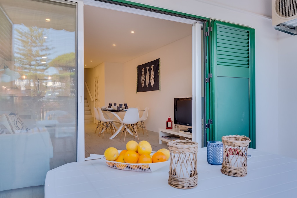 Terrace and living room views of a vacation rental just steps away from the sandy beaches of Vale do Lobo