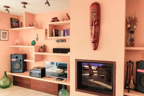 Stereo and home-cinema equipped living-room and fireplace