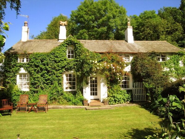 Tom's Cottage. The cottage's front door and the enclosed garden