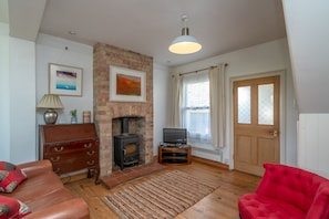 Seated area what door leading into kitchen