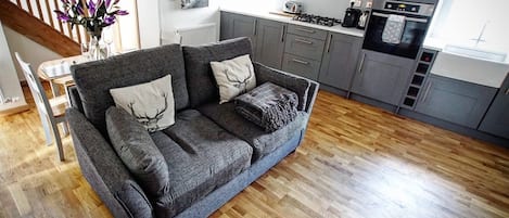 Our open plan living dining area with sofa bed.