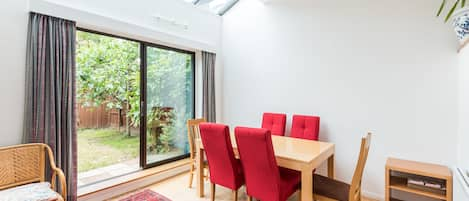 The spacious dining area leads directly into the garden