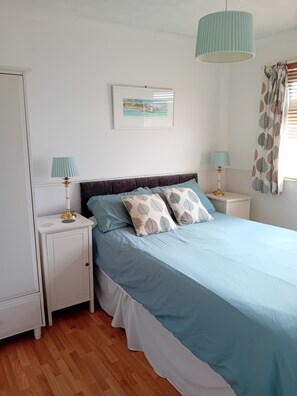 Bedroom 1 - Double bed, velour headboard, bedside cupboards and lamps