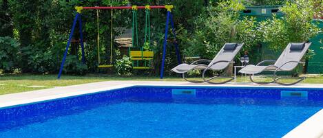 Water, Plant, Swimming Pool, Azure, Rectangle, Outdoor Furniture, Shade, Grass, Leisure, Composite Material