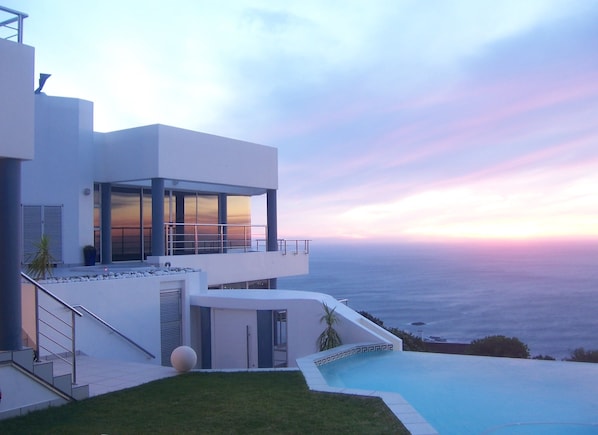 Villa at sunset from the pool lawn area