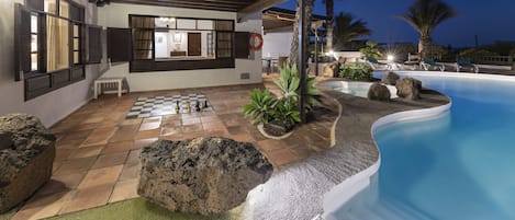 Pool area and main terrace at night