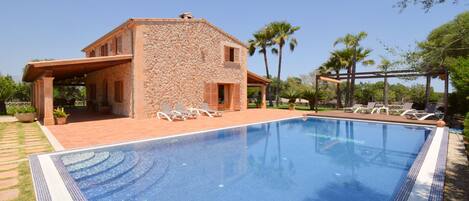 Photo of the pool with deckchairs