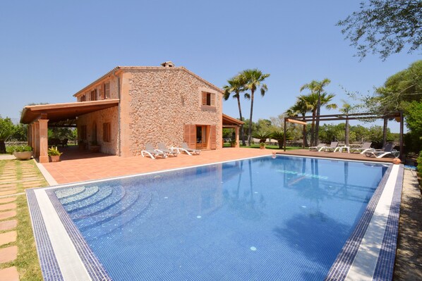 Photo of the pool with deckchairs