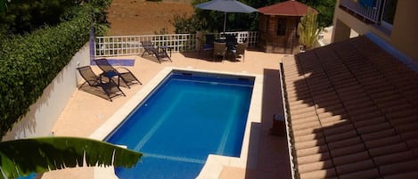 View from front lawn looking down onto private  pool 