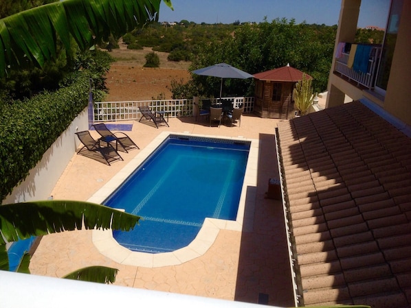 View from front lawn looking down onto private  pool 